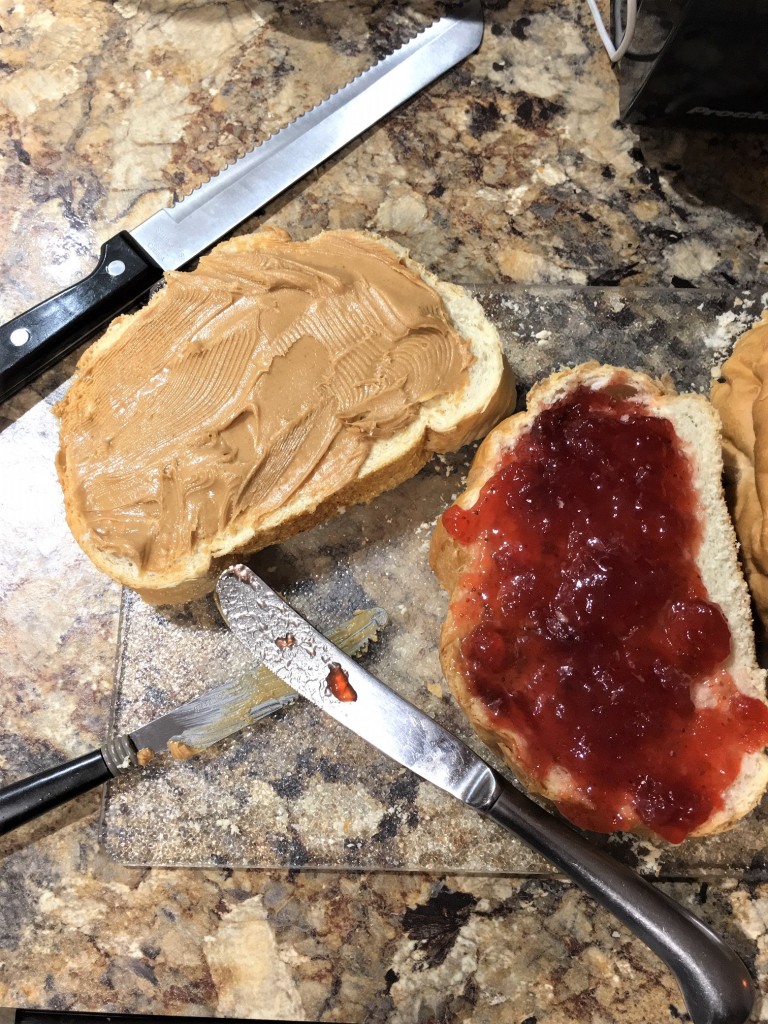 Peanut Butter and Jelly Bread Pudding made with sourdough bread and homemade custard. Gobs of peanut butter and strawberry jam. PB&J never tasted this good!